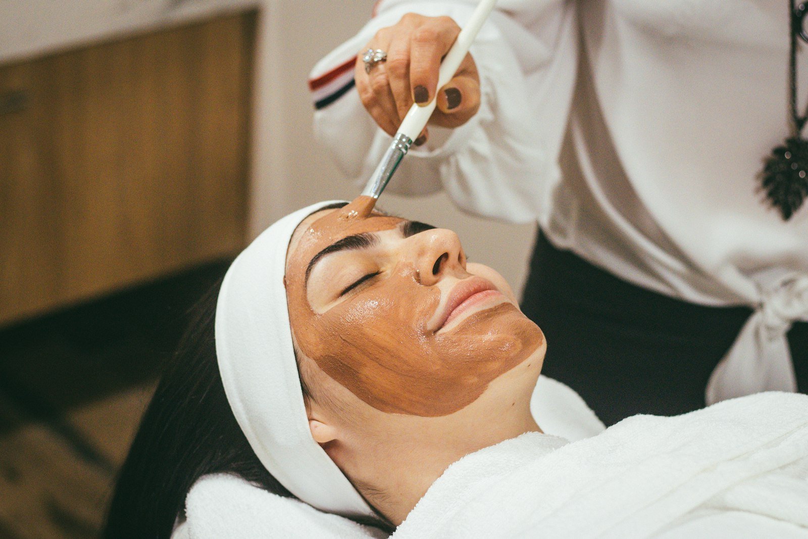 Woman applying skincare cream
