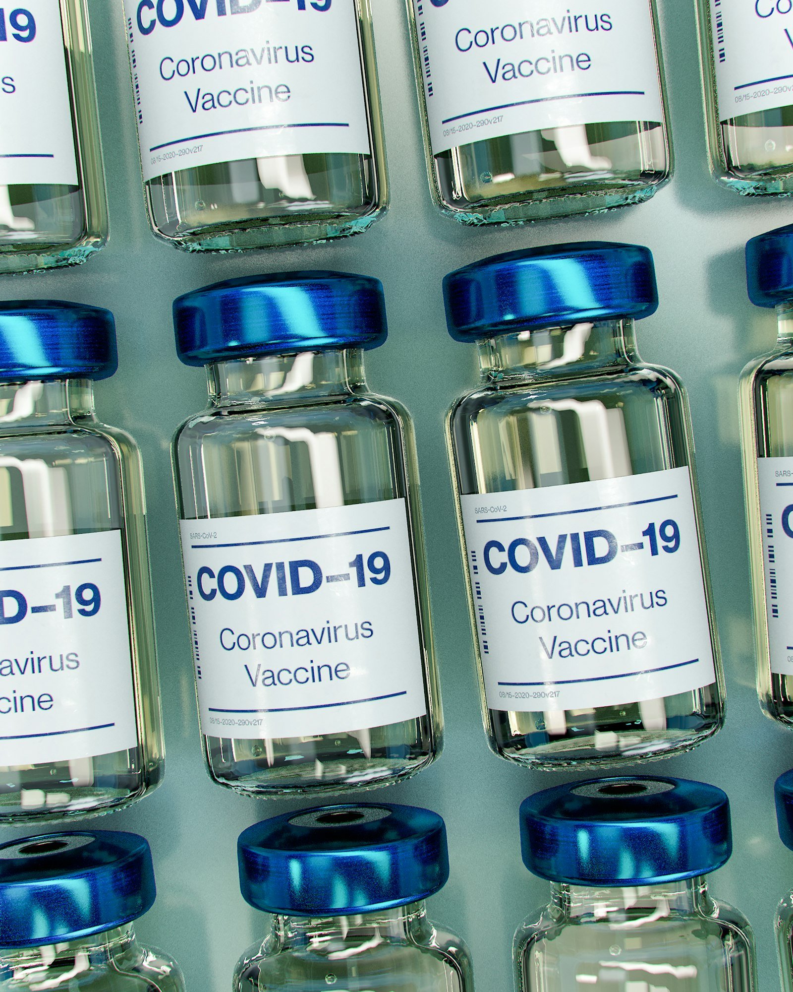 Doctor preparing a vaccine syringe